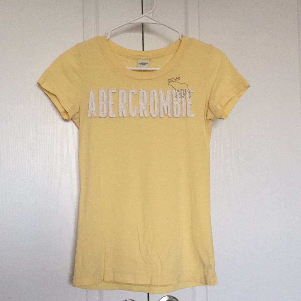 Bright and shiny yellow logo top